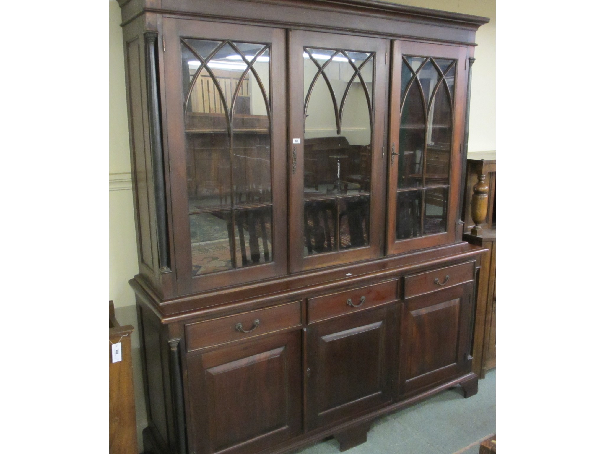 Appraisal: A mahogany three door bookcase