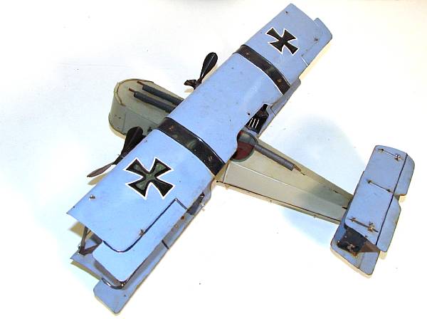 Appraisal: European Bi-wing Airplane An early x pressed tin plane with