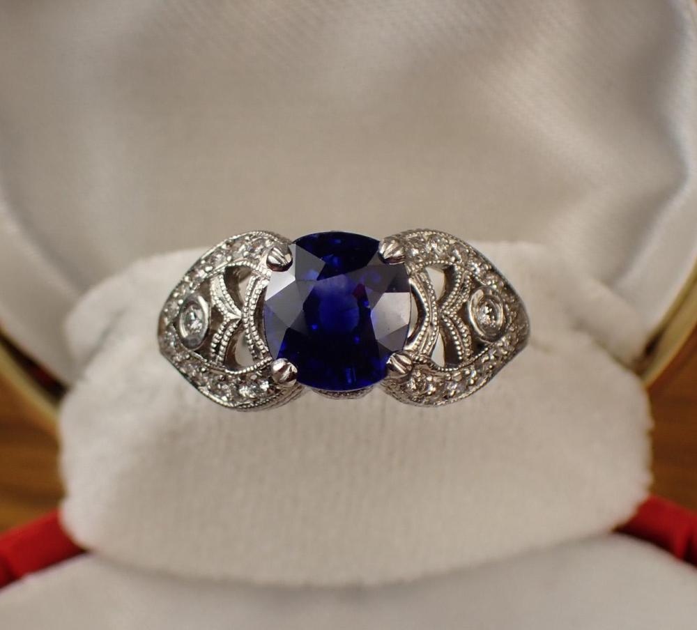 Appraisal: ANTIQUE BLUE SAPPHIRE DIAMOND AND PLATINUM RING The hand engraved