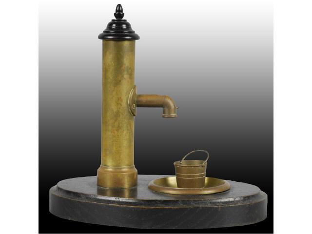 Appraisal: Brass Water Pump Cigar Cutter on Wood Base Description Lift