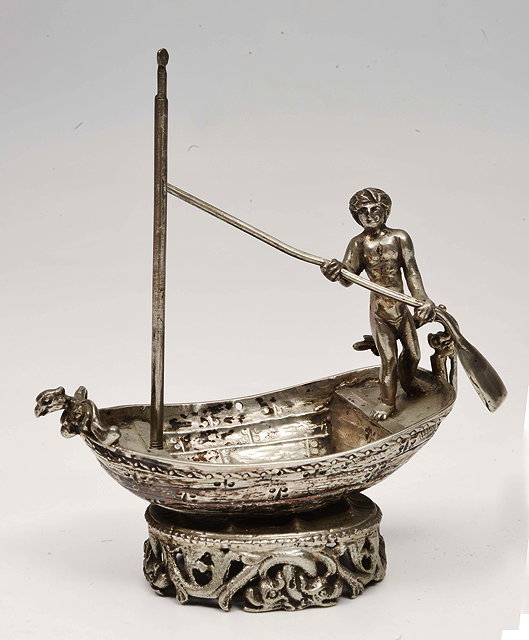 Appraisal: A CONTINENTAL WHITE METAL MODEL OF A MAN standing in