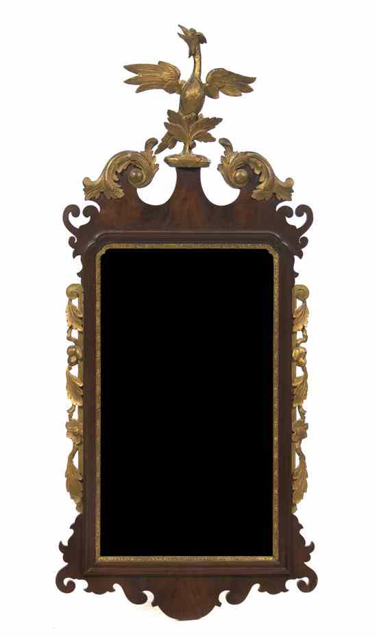 Appraisal: A Chippendale Style Parcel Gilt Mahogany Mirror having an eagle