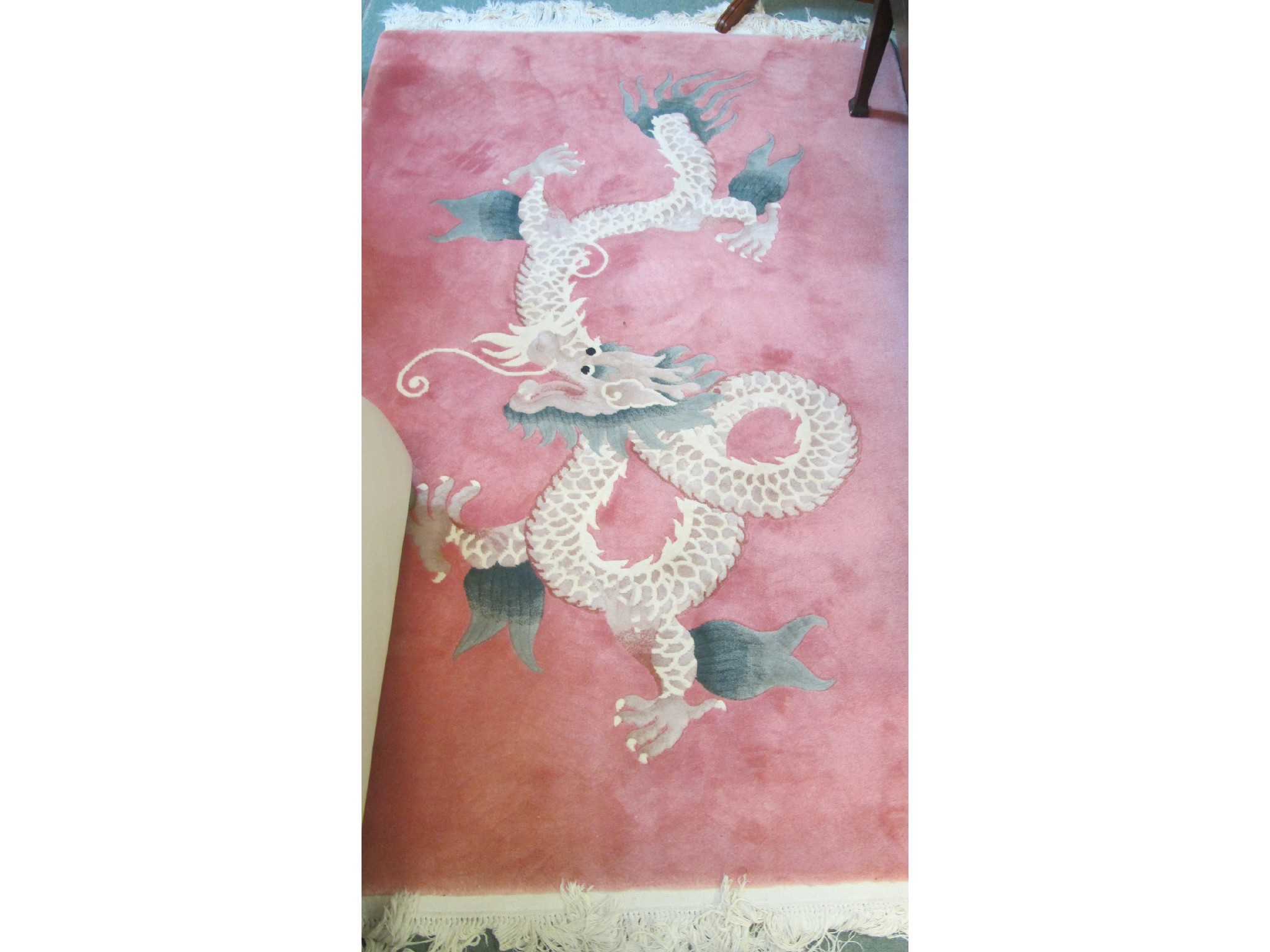 Appraisal: Two Chinese rugs pink ground with dragon motif