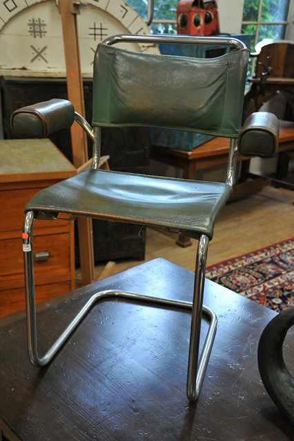 Appraisal: A SET OF FOUR CANTILEVER CHAIRS c chromed metal leather