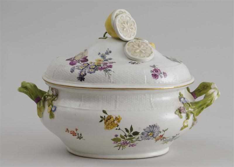 Appraisal: CONTINENTAL PORCELAIN TWO-HANDLED TUREEN AND COVER With floral clusters basketweave