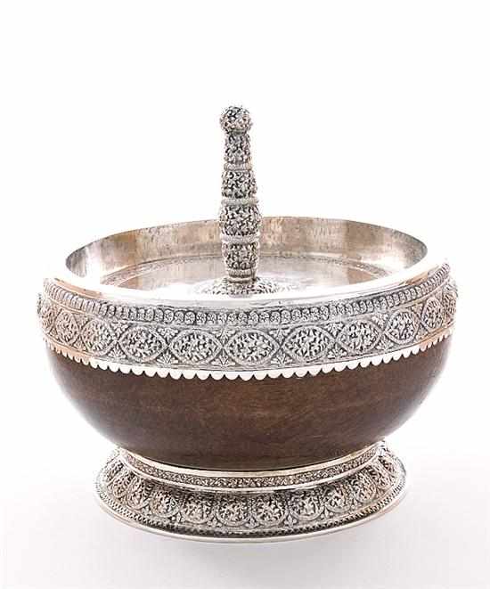 Appraisal: Silver-mounted coconut drupe covered bowl th century shell bound in