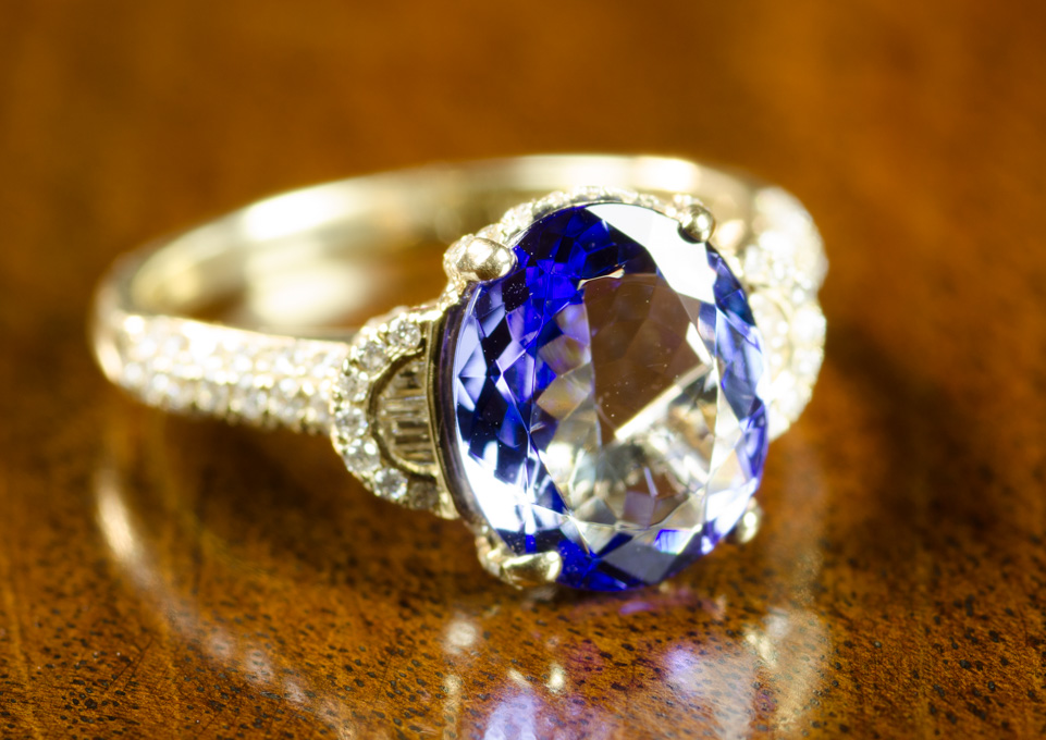 Appraisal: TANZANITE DIAMOND AND FOURTEEN KARAT GOLD RING with round-cut and