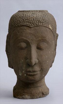 Appraisal: SOUTHEAST ASIAN CARVED SANDSTONE HEAD OF BUDDHA The head with