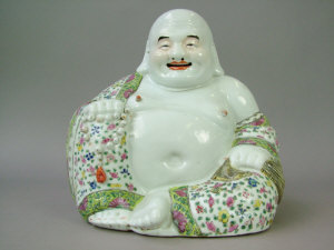 Appraisal: Chinese porcelain figure of a seated Buddha his robe with