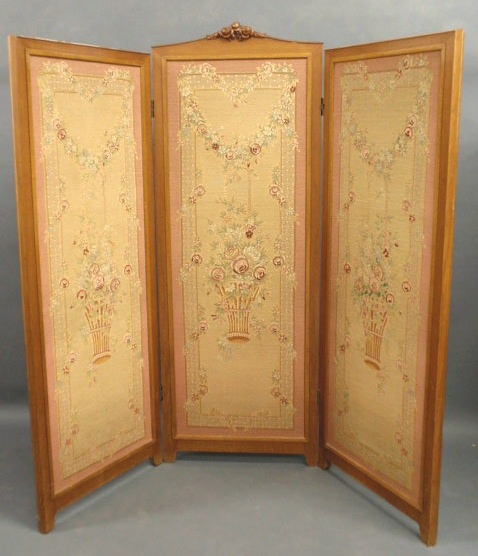 Appraisal: French three-sectioned screen with a walnut frame and floral needlepoint