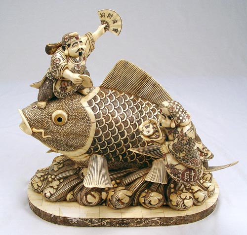 Appraisal: LARGE CHINESE BONE SCULPTURE OF FISH men riding a large