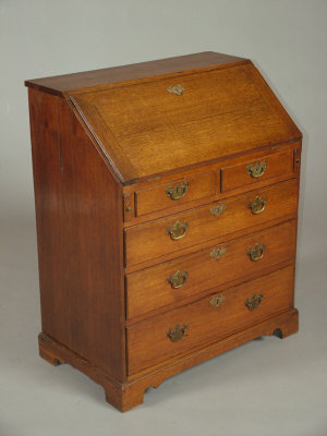 Appraisal: An oak bureau early th century the cleated fall front