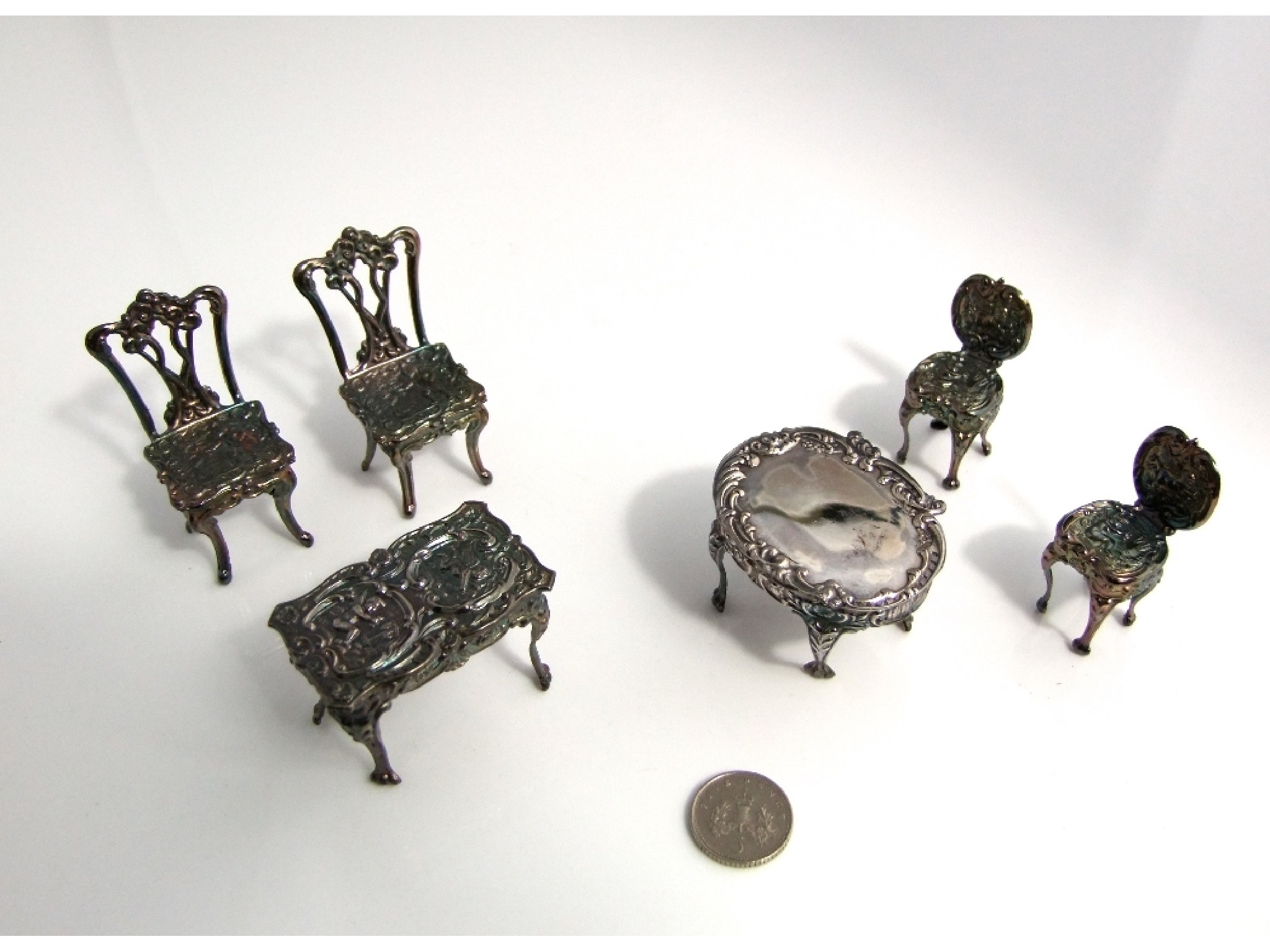 Appraisal: A collection of miniature silver salon furniture chairs sofa and