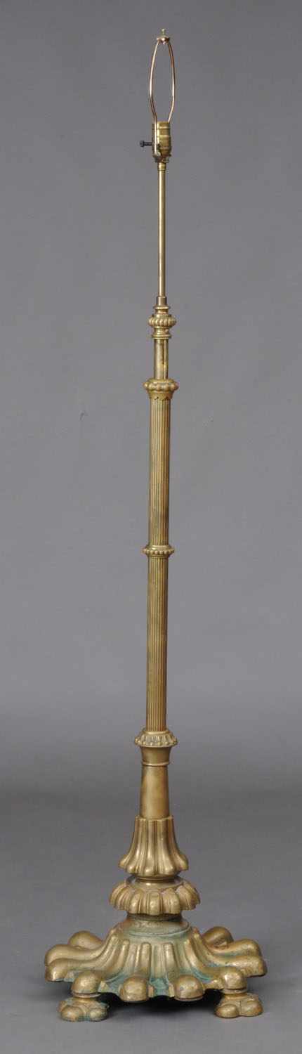 Appraisal: RENAISSANCE STYLE BRASS FLOOR LAMP The reeded stem with beaded