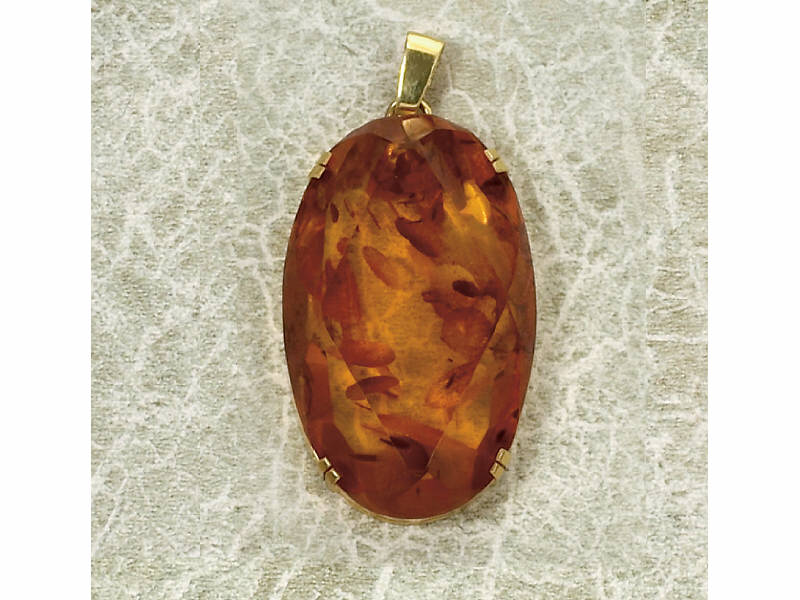 Appraisal: AMBER PENDANT Large oval clear amber with faceted crown and