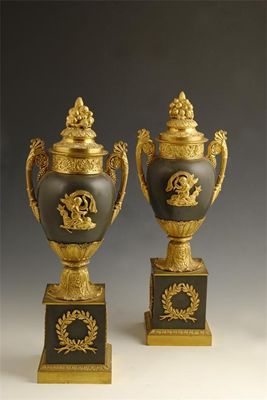 Appraisal: A pair of Empire style ormolu and bronze urns the