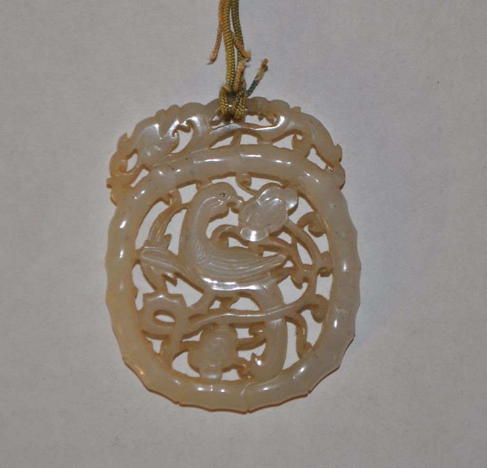 Appraisal: Pierce Carved Jade Pendant on cord Pendant dragon phoenix bamboo