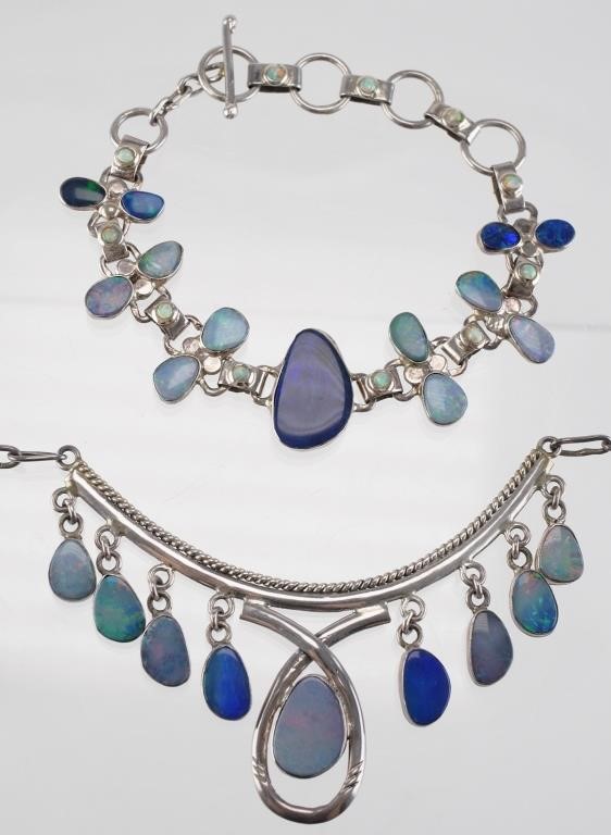 Appraisal: Sterling silver necklace with eight dangling bezel set opals measuring