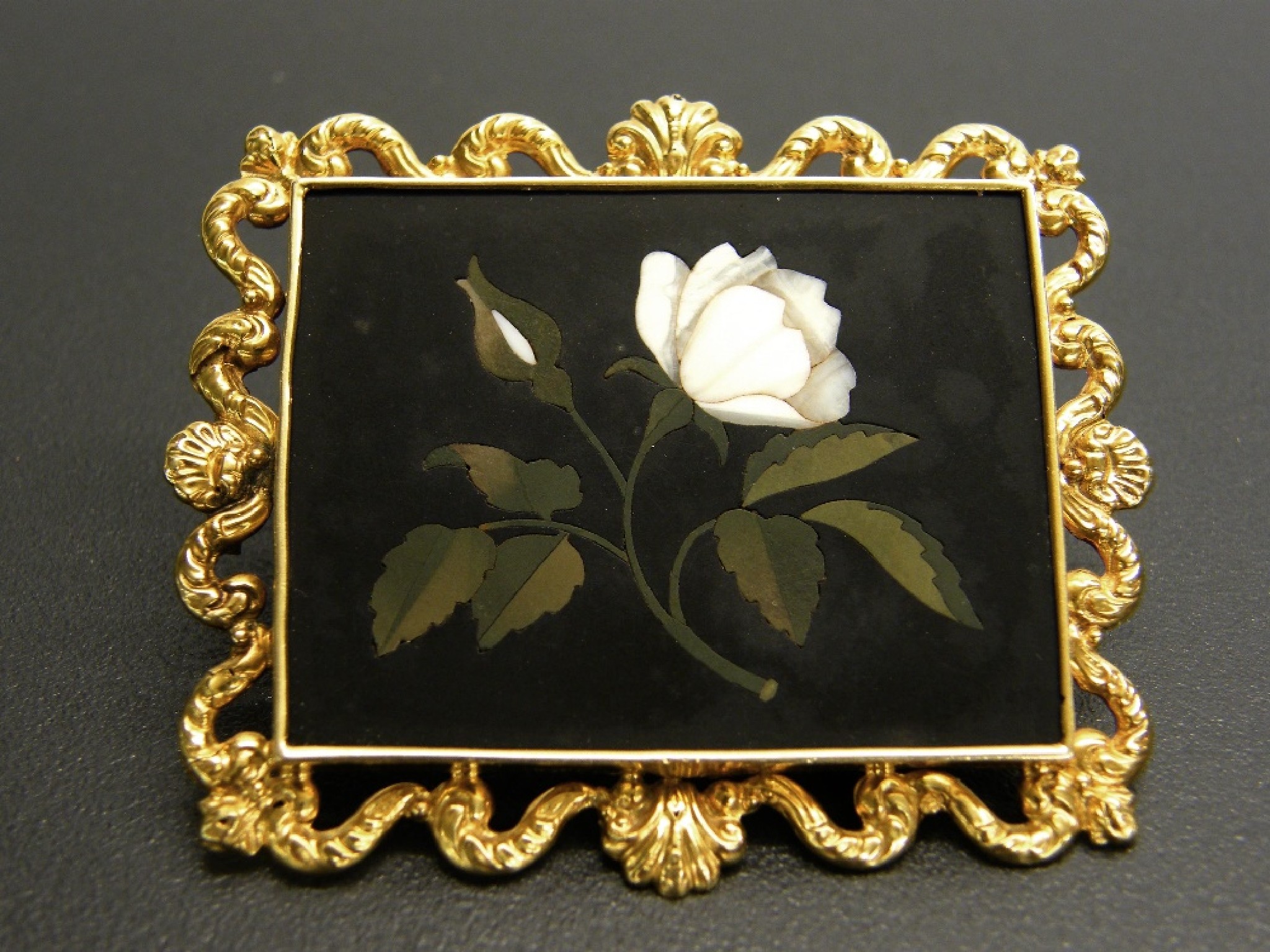 Appraisal: Pietra dura rectangular brooch depicting a white rose within a