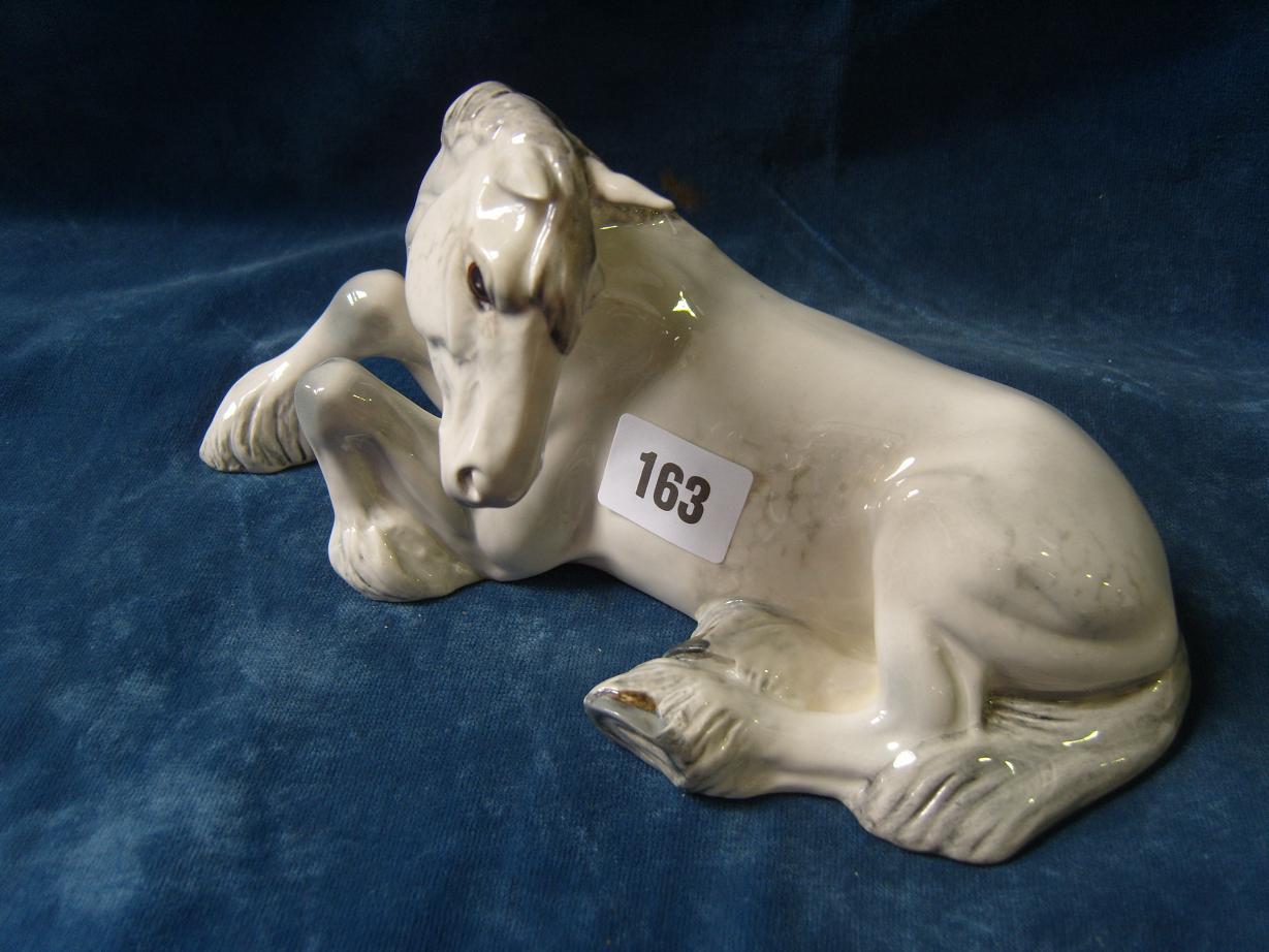 Appraisal: A Beswick model of a recumbent white shire horse with