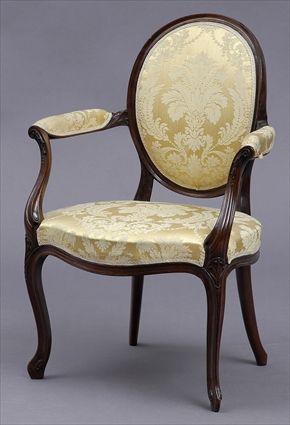 Appraisal: GEORGE III-STYLE CARVED MAHOGANY ARMCHAIR IN THE FRENCH TASTE The