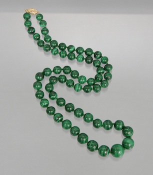 Appraisal: An Impressive Strand of Malachite Beads A hand-knotted strand of