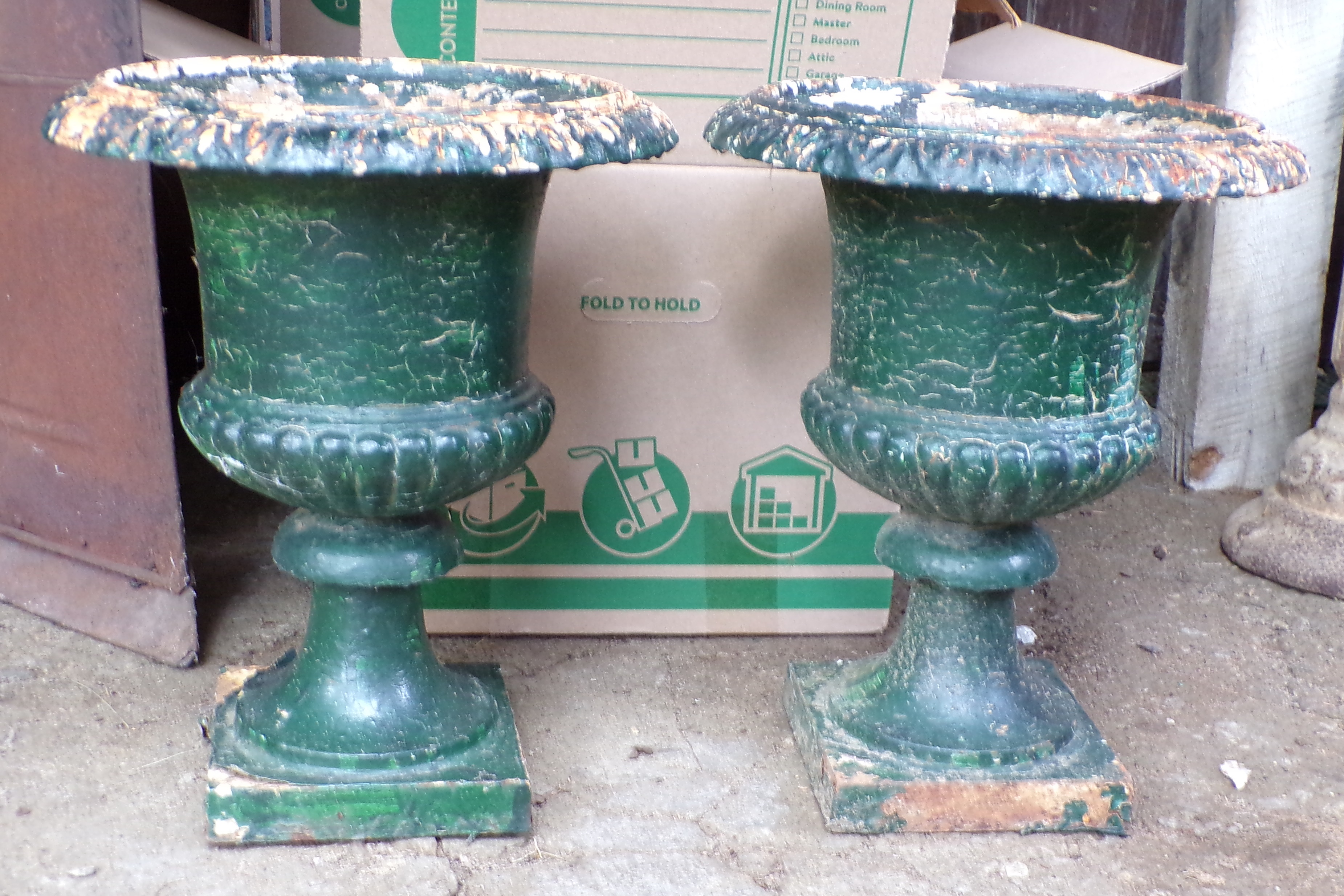 Appraisal: Pair of cast iron garden planters painted green ''h