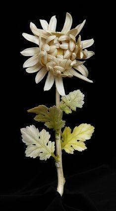 Appraisal: JAPANESE YELLOW-TO-GREEN STAINED IVORY CHRYSANTHEMUM STEM Realistically rendered with concentric