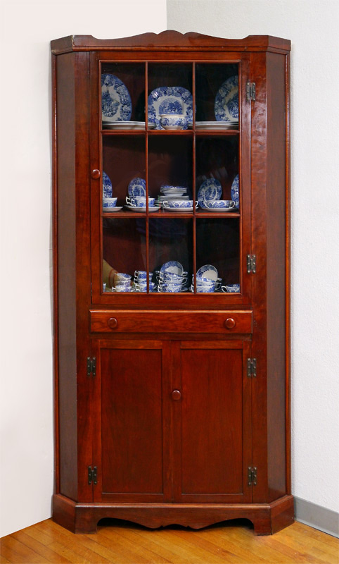 Appraisal: MAHOGANY CORNER CABINET light top door with shelves over single