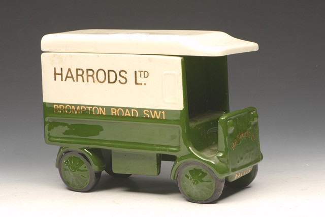 Appraisal: A POTTERY BISCUIT BOX in the form of a Harrods