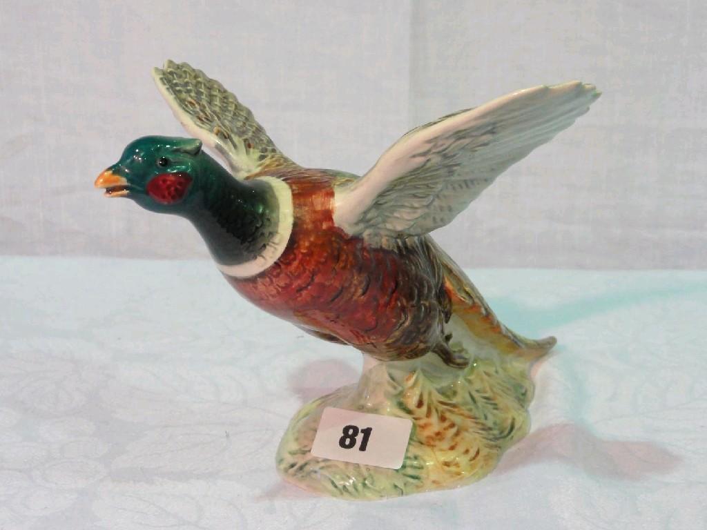 Appraisal: A Beswick model of a pheasant with outstretched wings and