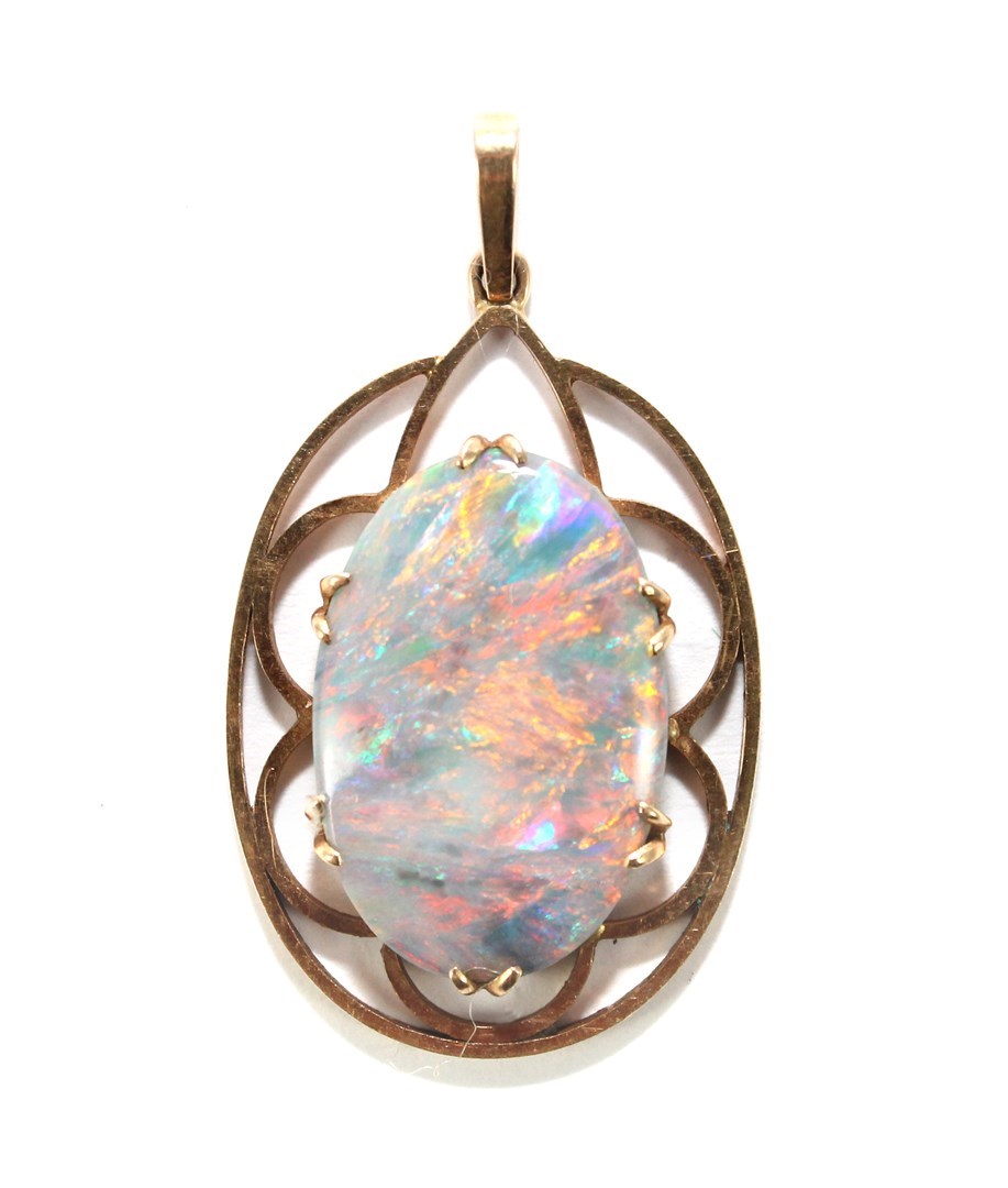 Appraisal: A gold and opal set single stone pendant claw set