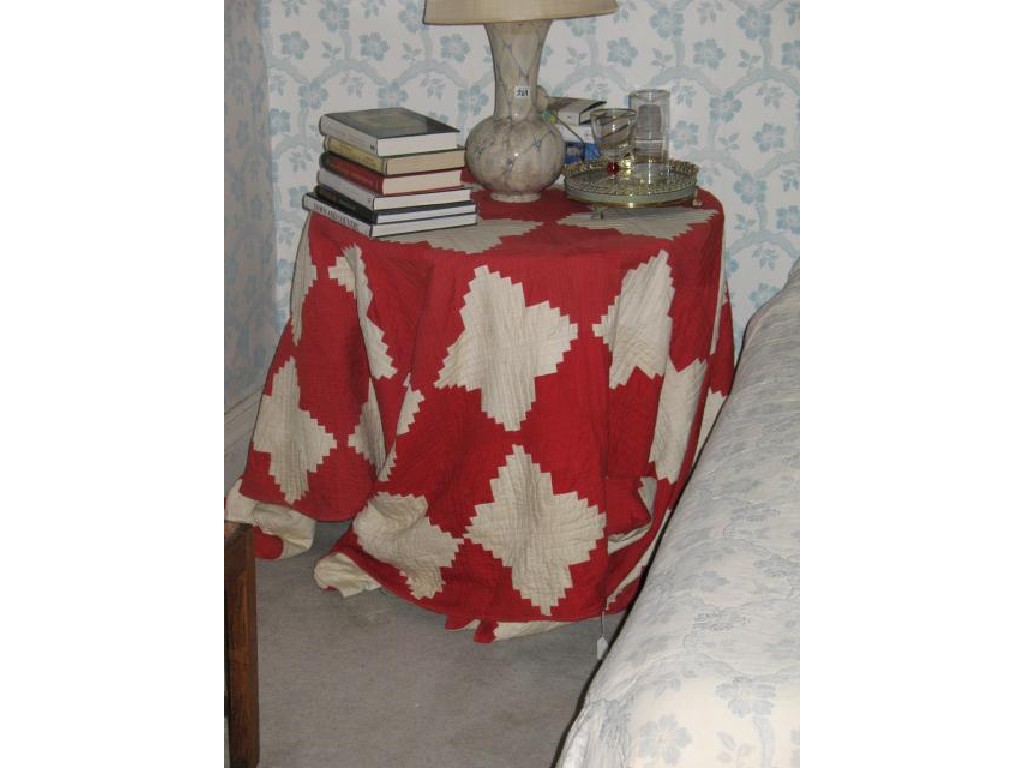 Appraisal: A CIRCULAR OCCASIONAL TABLE with an American style quilt cover