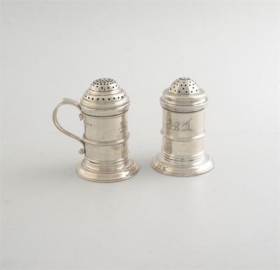 Appraisal: A near pair of kitchen peppers with moulded bands and