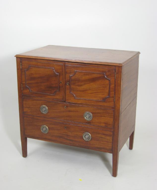 Appraisal: A Georgian mahogany Commode Chest with two panelled doors dummy