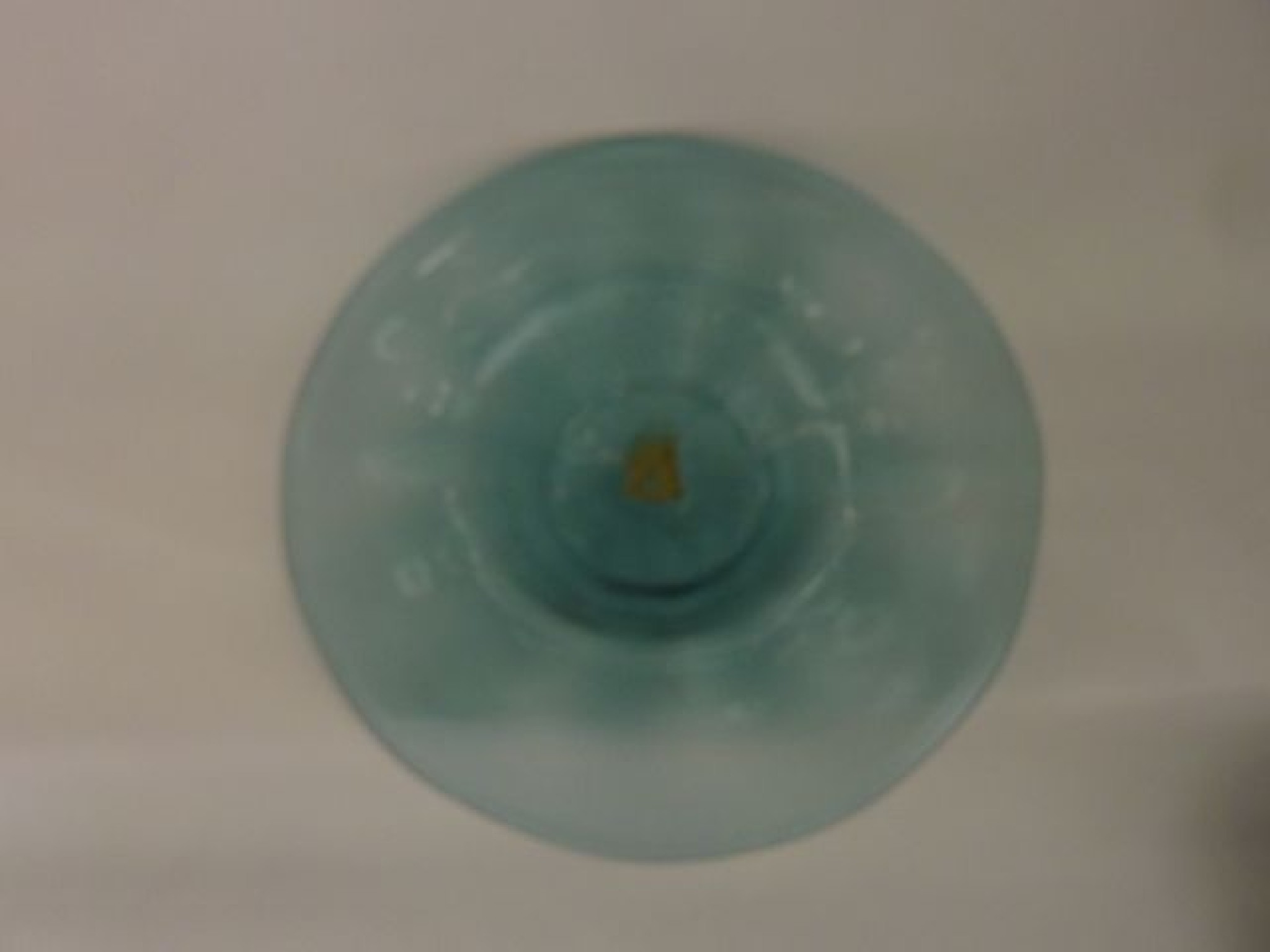 Appraisal: A th century pale blue studio glass charger of circular