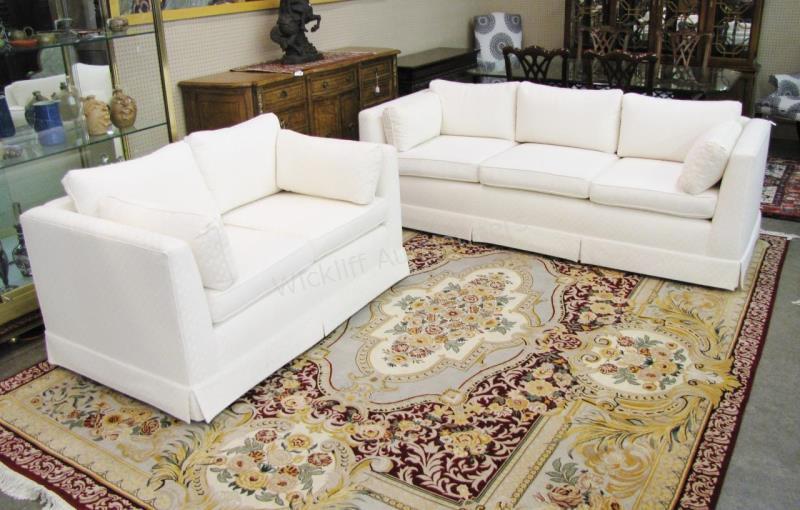 Appraisal: A decorator quality sofa and love seat with textured white