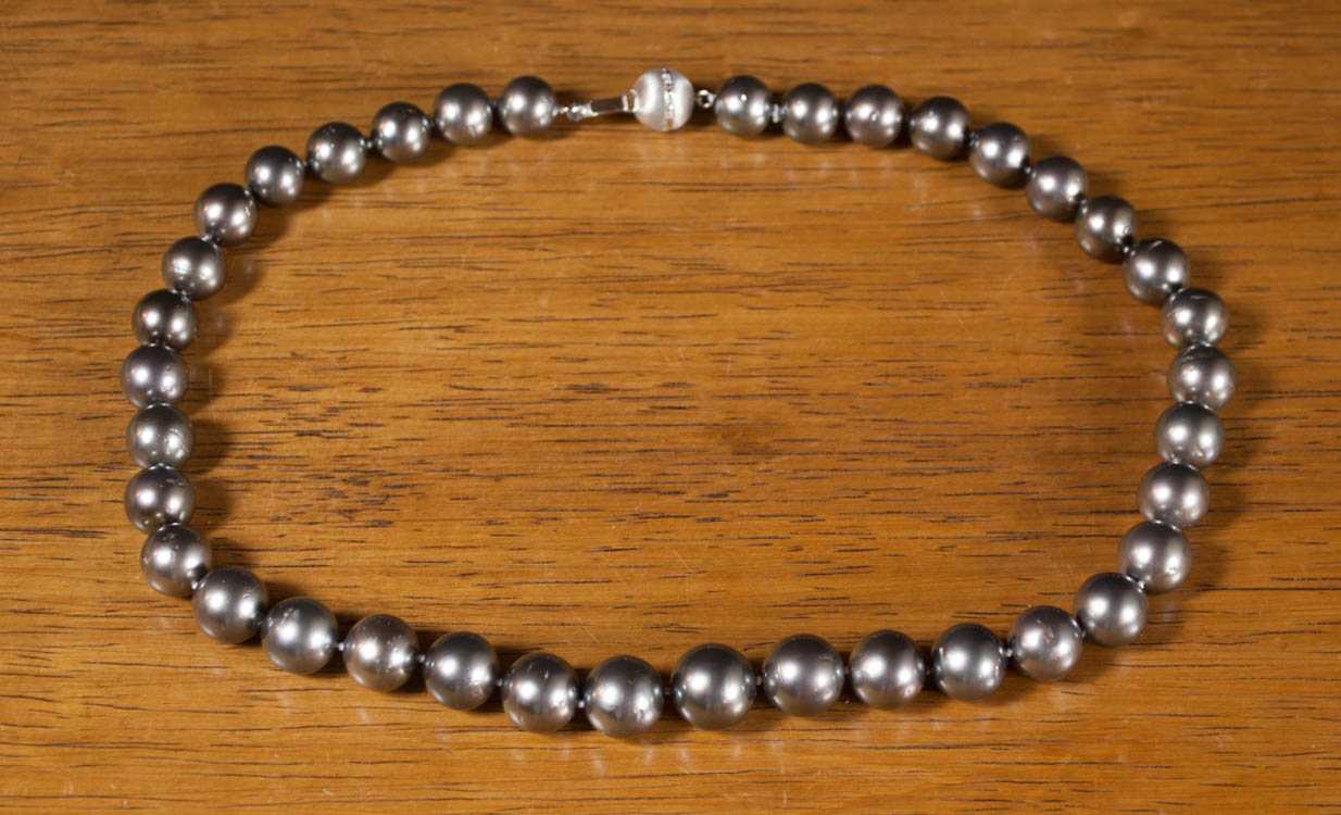 Appraisal: PRINCESS LENGTH TAHITIAN PEARL NECKLACE featuring round graduated black pearls