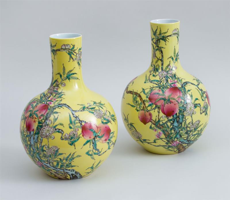 Appraisal: PAIR OF CHINESE YELLOW-GROUND FAMILLE ROSE PORCELAIN BOTTLE VASES With