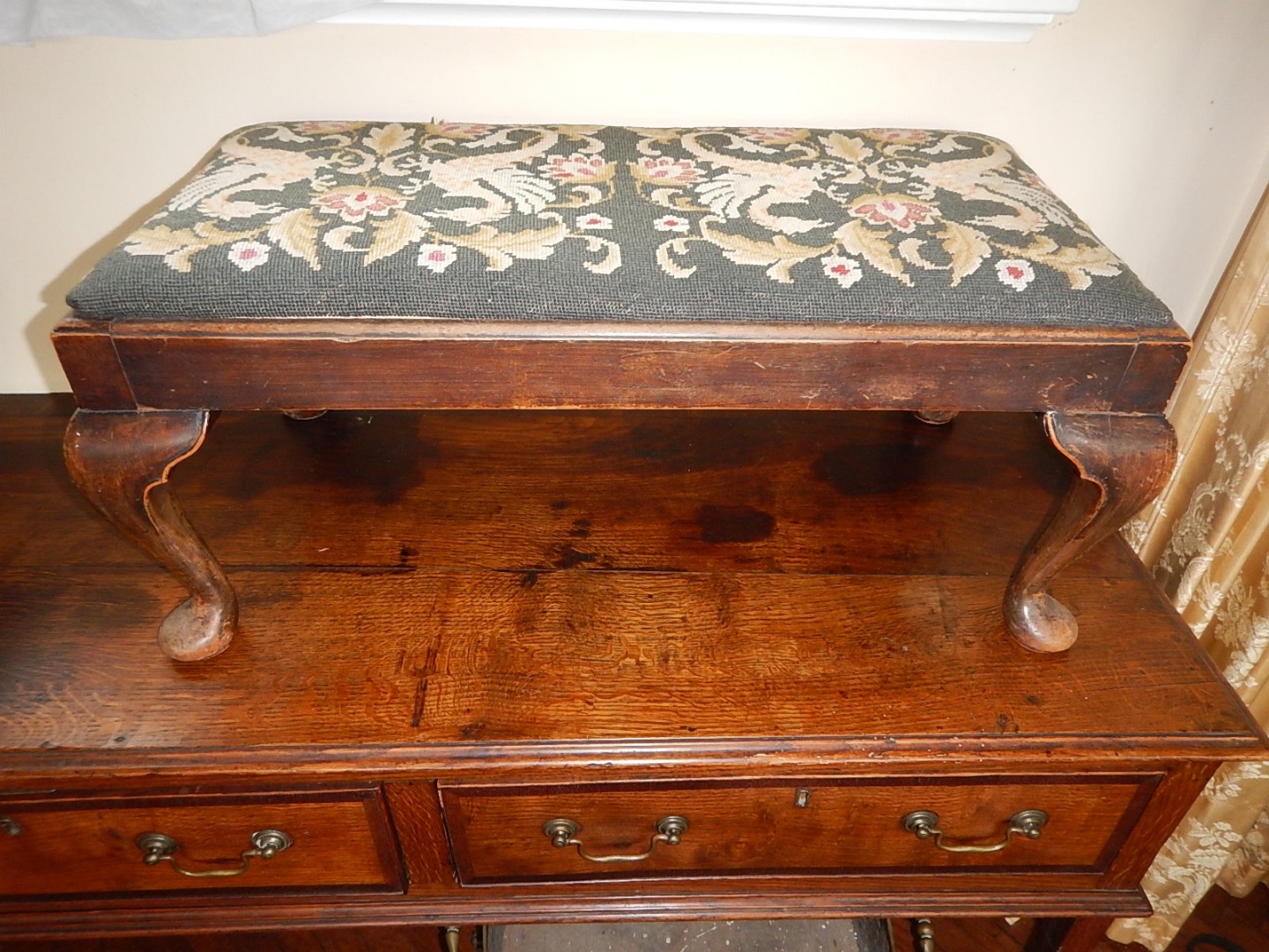 Appraisal: A Georgian style mahogany stool with work needlework seat and