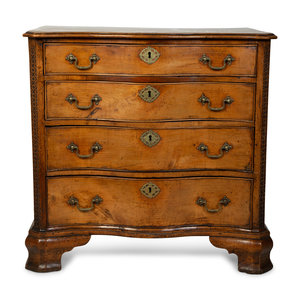 Appraisal: A George III Walnut Serpentine Chest of Drawers TH CENTURY