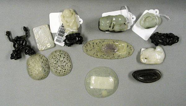 Appraisal: Nine jade and hardstone carvings The first a reticulated miniature