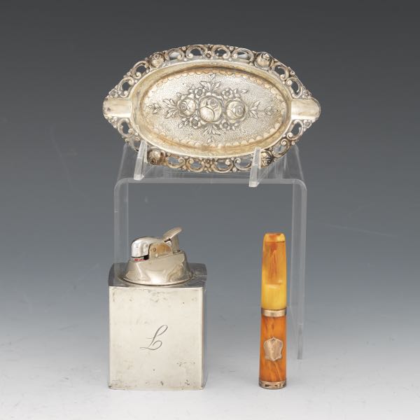 Appraisal: THREE STERLING GERMAN SILVER AND FAUX AMBER TOBACCIANA ARTICLES Including