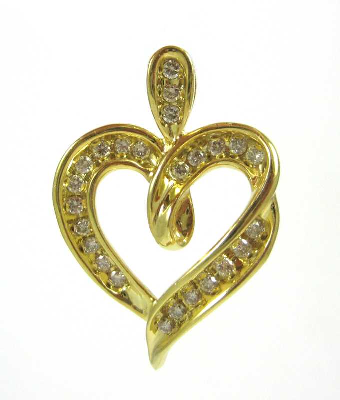 Appraisal: DIAMOND AND TEN KARAT GOLD PENDANT The yellow gold open