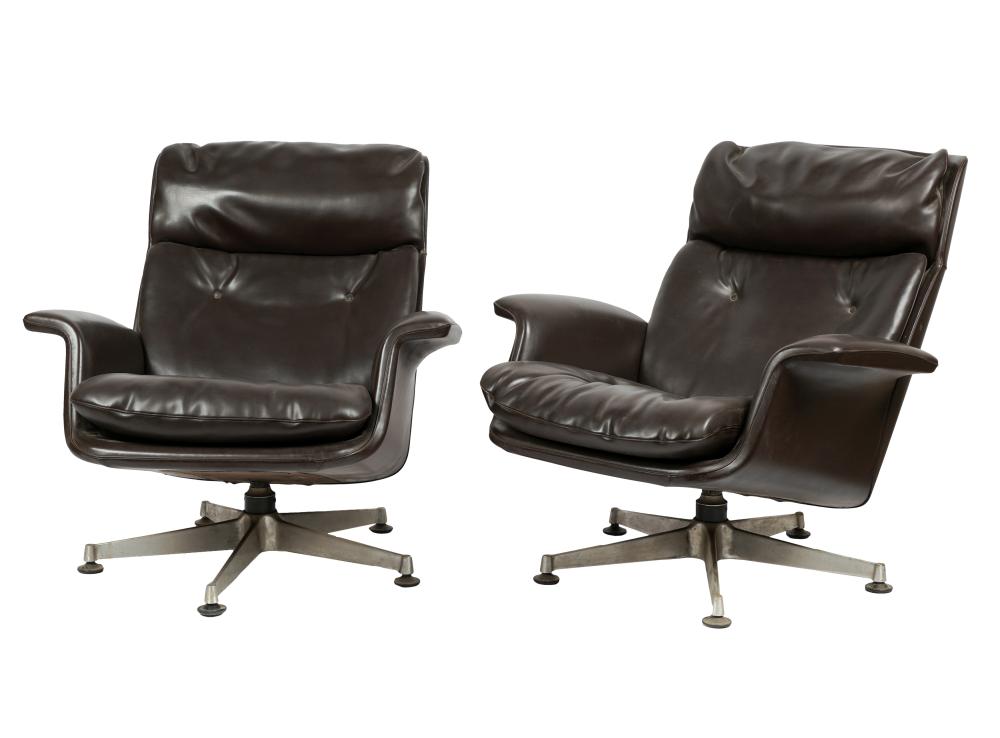 Appraisal: PAIR OF ANONIMA CASTELLI SWIVEL CHAIRSbrown leather and chromed metal