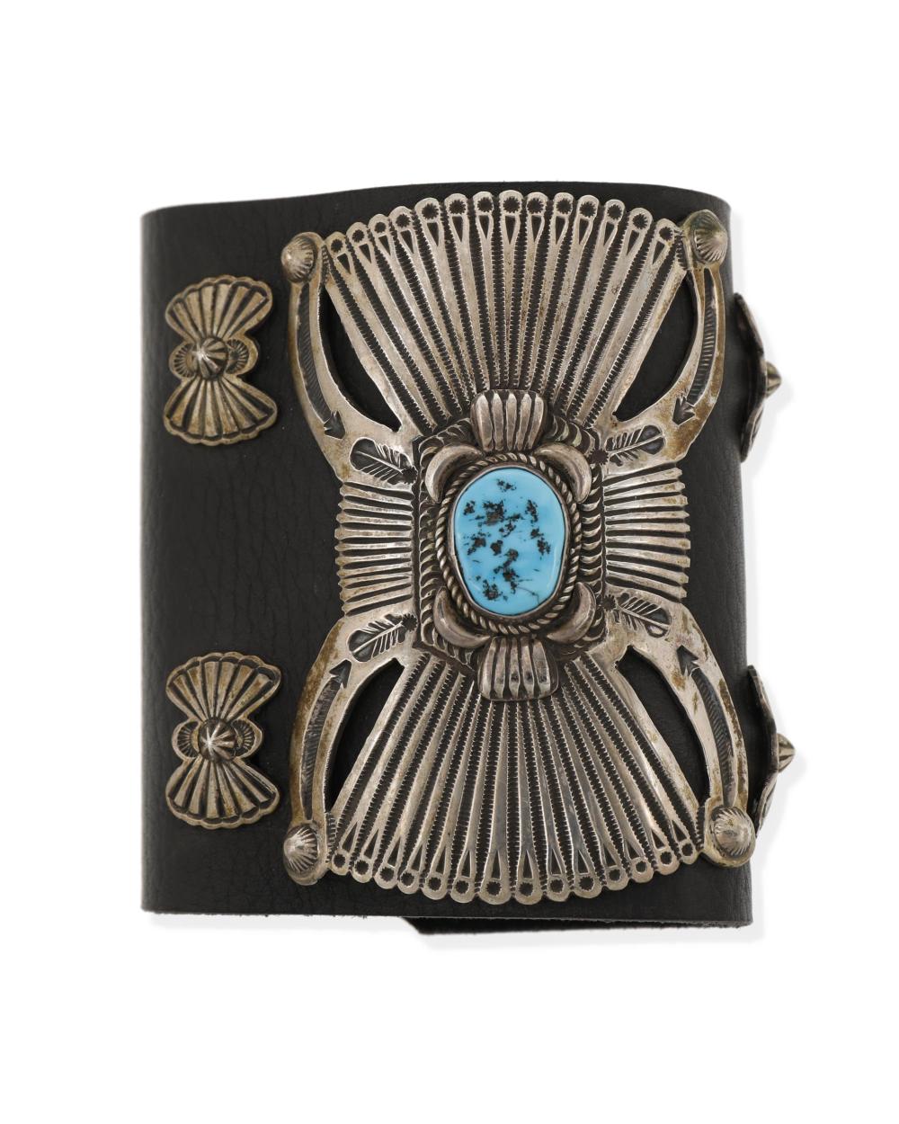 Appraisal: A Navajo silver and turquoise ketoh arm guard Fourth-Quarter th