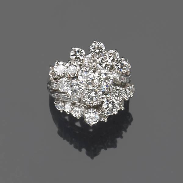 Appraisal: A diamond platinum and white gold cluster ring estimated total