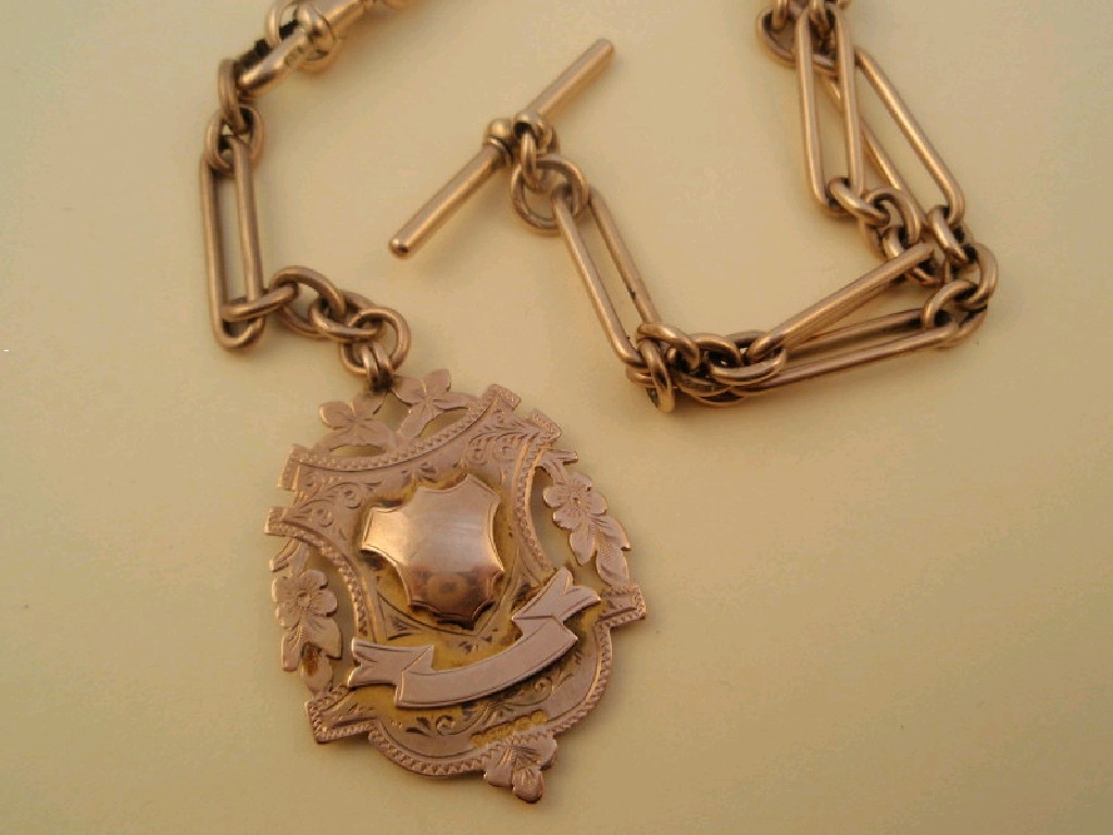 Appraisal: A Victorian ct rose gold Albert and attached fob weight