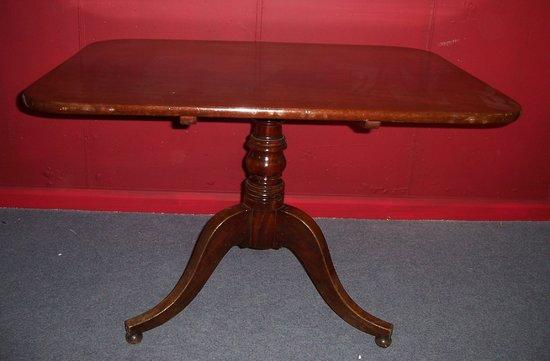 Appraisal: A George IV rectangular mahogany table raised on a turned