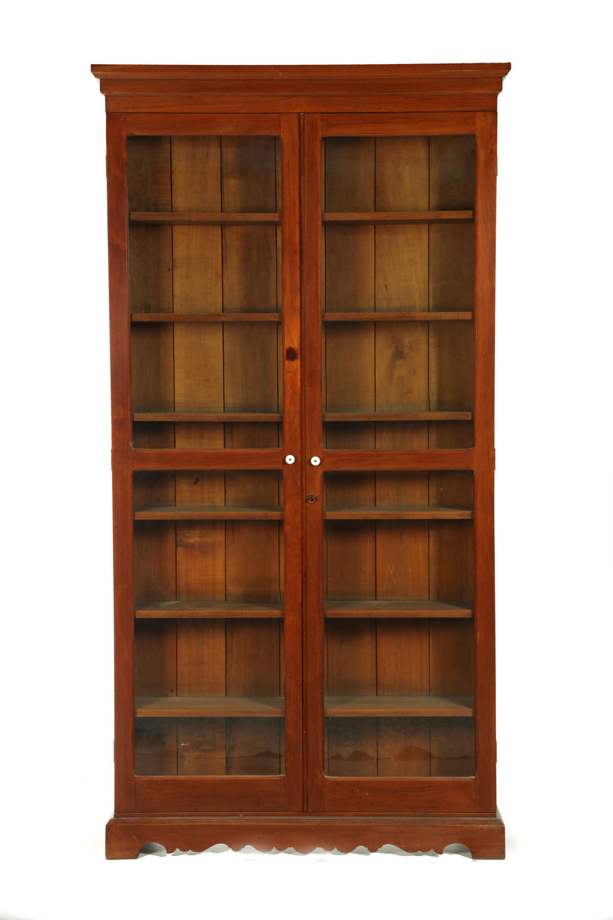 Appraisal: VICTORIAN BOOKCASE American early th century One piece walnut bookcase